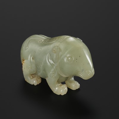 A PALE CELADON JADE FIGURE OF A BEAR, LATE MING TO EARLY QING DYNASTY