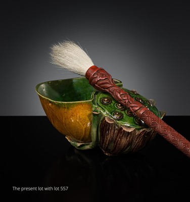 Lot 411 - A CARVED CINNABAR LACQUER ‘PEONY’ BRUSH, MING DYNASTY