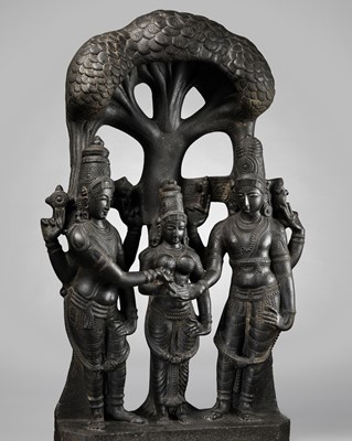 Lot 204 - A MONUMENTAL AND EXTREMELY RARE BLACK BASALT OPENWORK STELE, DEPICTING THE CELESTIAL WEDDING OF SHIVA AND PARVATI, KALYANASUNDARA