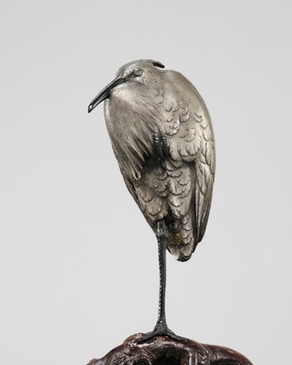 Lot 57 - MARUKI COMPANY: A CHARMING SILVERED BRONZE OKIMONO OF AN EGRET IN THE COLD