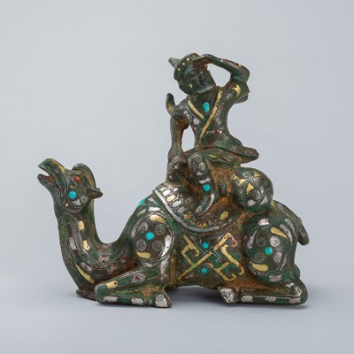 Lot 1568 - AN INLAID BRONZE FIGURE OF A CAMEL WITH RIDER, TANG DYNASTY