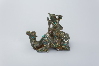 Lot 1568 - AN INLAID BRONZE FIGURE OF A CAMEL WITH RIDER, TANG DYNASTY