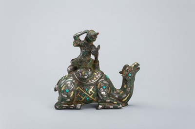 Lot 1568 - AN INLAID BRONZE FIGURE OF A CAMEL WITH RIDER, TANG DYNASTY
