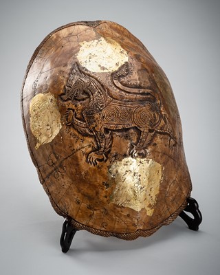 Lot 1002 - A TORTOISE CARAPACE CARVED WITH SINGHA AND KHMER SANSKRIT