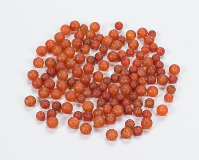 Lot 1004 - A LOT WITH 126 CARNELIAN AGATE BEADS, 10TH TO 12TH CENTURY