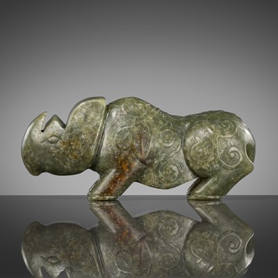 Lot 473 - AN ARCHAISTIC JADE CARVING OF A RHINOCEROS, QING DYNASTY