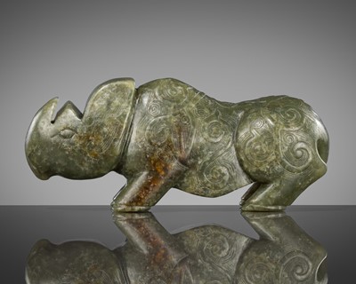 Lot 186 - AN ARCHAISTIC JADE CARVING OF A RHINOCEROS, QING DYNASTY