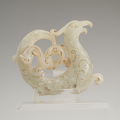 Lot 812 - A CELADON JADE ‘PHOENIX AND DRAGON’ PENDANT, HUAN, HAN DYNASTY