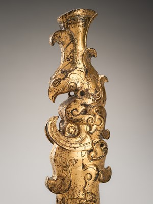 Lot 721 - A GILT-BRONZE ‘WINGED BEAST’ FINIAL, QING DYNASTY, WARRING STATES STYLE