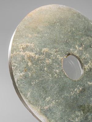 Lot 886 - A LARGE PALE GREEN JADE DISK (BI), LATE NEOLITHIC PERIOD, LIANGZHU CULTURE