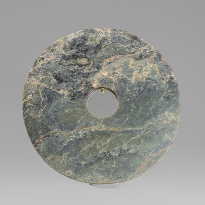 Lot 887 - A GREEN JADE DISK (BI), LATE NEOLITHIC PERIOD, LIANGZHU CULTURE