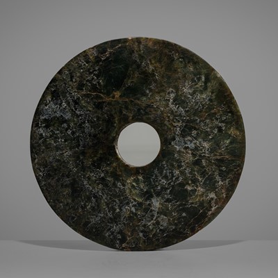 Lot 888 - A DARK GREEN JADE DISK (BI), LATE NEOLITHIC PERIOD, LIANGZHU CULTURE