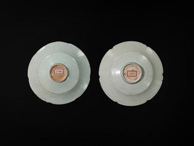 Lot 495 - TWO CARVED FLORIFORM QINGBAI ‘PEONY’ DISHES, SONG DYNASTY