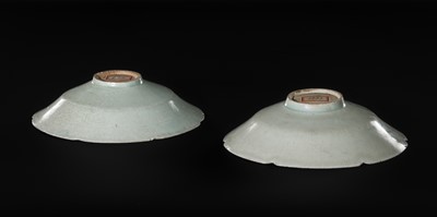 Lot 495 - TWO CARVED FLORIFORM QINGBAI ‘PEONY’ DISHES, SONG DYNASTY