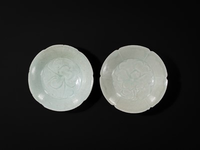 Lot 495 - TWO CARVED FLORIFORM QINGBAI ‘PEONY’ DISHES, SONG DYNASTY