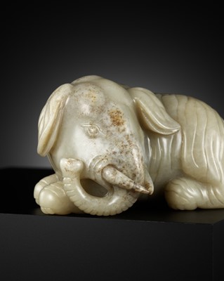 Lot 449 - A GREEN AND GREY JADE FIGURE OF AN ELEPHANT, LATE MING-EARLY QING DYNASTY, 17TH-18TH CENTURY