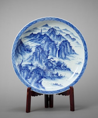Lot 1141 - A MONUMENTAL ARITA PORCELAIN CHARGER WITH A MOUNTAIN LANDSCAPE