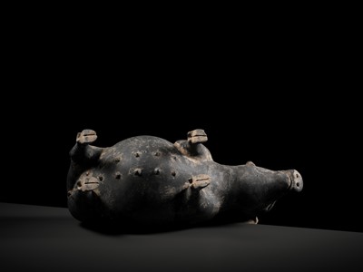 Lot 127 - A BLACK PAINTED POTTERY FIGURE OF A PREGNANT SOW, HAN DYNASTY