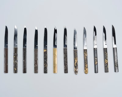 Lot 560 - A SET OF TWELVE MIXED METAL KOZUKA KNIVES