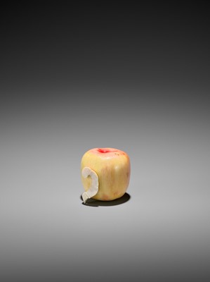 Lot 109 - A STAINED IVORY ‘TROMPE L’OEIL’ OKIMONO OF AN APPLE
