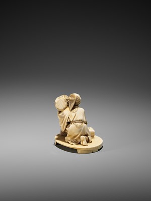 Lot 151 - AN IVORY OKIMONO OF A COURT DRUMMER