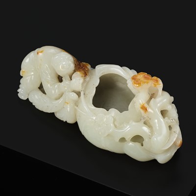 A WHITE AND RUSSET JADE ‘BOY AND LOTUS’ BRUSH WASHER, QING DYNASTY