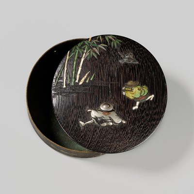 Lot 132 - A GILT-BRONZE CIRCULAR BOX WITH FINE INLAID WOOD COVER