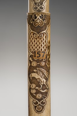 A FINE ANTLER KISERUZUTSU WITH A BIRD AND BRANCHES