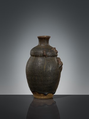 Lot 355 - A BROWN-GLAZED HUMANOID STONEWARE JAR, ANGKOR PERIOD