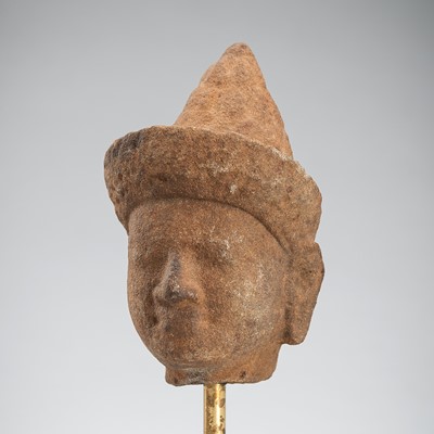 A SANDSTONE HEAD OF A MALE DEITY, ANGKOR PERIOD