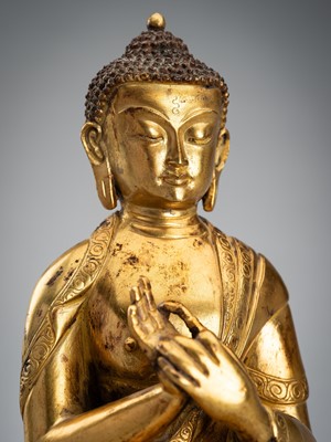 Lot 1483 - A GILT BRONZE FIGURE OF BUDDHA