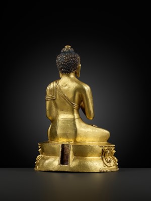 Lot 17 - A GILT-BRONZE FIGURE OF SHAKYAMUNI BUDDHA, TIBET, 15TH – 16th CENTURY