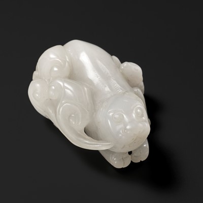 Lot 168 - A WHITE JADE CARVING OF A MYTHICAL BEAST WITH LINGZHI AND BAT, QING DYNASTY