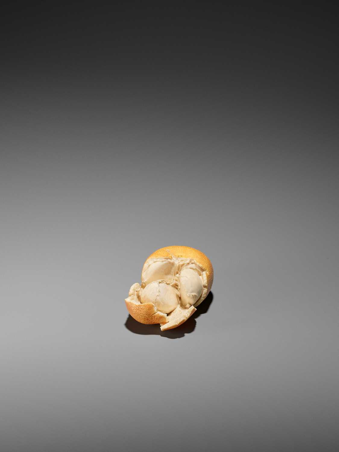 Lot 219 - BISAI: A STAINED IVORY ‘TROMPE-L’OEIL’ OKIMONO OF A TANGERINE