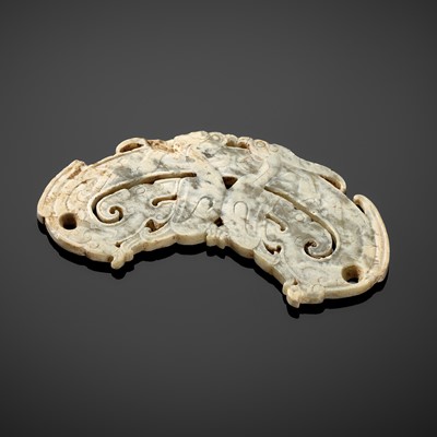 A RETICULATED ‘DRAGONS AND PHOENIXES’ JADE PENDANT, HUANG, EASTERN ZHOU DYNASTY