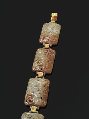 Lot 90 - A CELADON AND RUSSET JADE ‘FOUR GUARDIANS’ BELT, EASTERN HAN DYNASTY