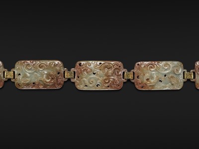 Lot 90 - A CELADON AND RUSSET JADE ‘FOUR GUARDIANS’ BELT, EASTERN HAN DYNASTY