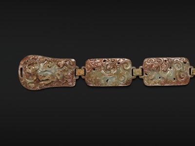 Lot 90 - A CELADON AND RUSSET JADE ‘FOUR GUARDIANS’ BELT, EASTERN HAN DYNASTY