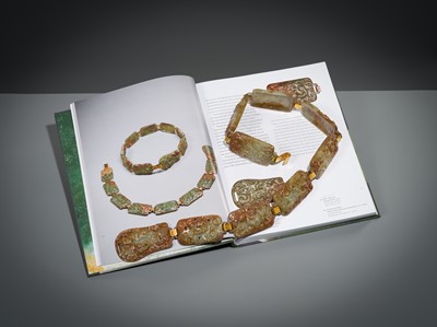 Lot 90 - A CELADON AND RUSSET JADE ‘FOUR GUARDIANS’ BELT, EASTERN HAN DYNASTY