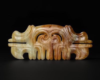 A LARGE RUSSET AND PALE CELADON ‘TOOTHED ANIMAL’ MASK ORNAMENT, HONGSHAN CULTURE