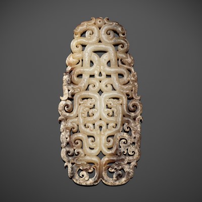 A LARGE RETICULATED WHITE AND RUSSET JADE PENDANT, EASTERN ZHOU DYNASTY