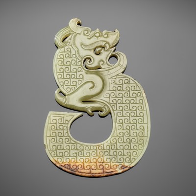 A GREEN AND RUSSET ‘DRAGON’ PENDANT, HAN DYNASTY