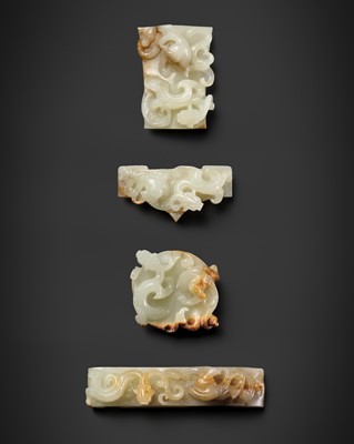AN IMPORTANT COMPLETE FOUR-PART SWORD FITTING SET OF PALE CELADON AND RUSSET JADE ‘CHILONG AND PHOENIX’, WESTERN HAN DYNASTY