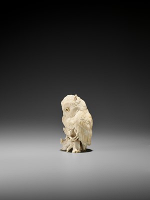 Lot 120 - RYUSAI: AN IVORY OKIMONO OF AN OWL CATCHING A FROG