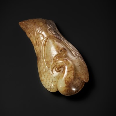 A PALE YELLOW AND RUSSET JADE PENDANT OF A PHOENIX, HAN DYNASTY