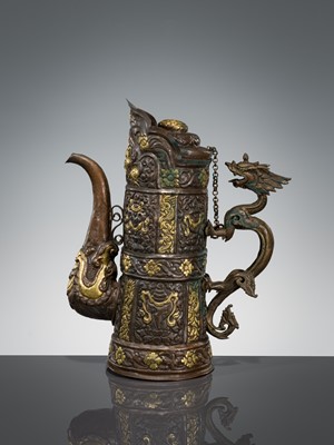 Lot 5 - A PARCEL-GILT COPPER REPOUSSÉ RITUAL EWER, DUOMUHU, TIBET, 19TH CENTURY