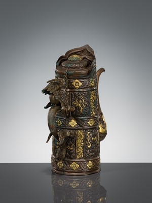 Lot 5 - A PARCEL-GILT COPPER REPOUSSÉ RITUAL EWER, DUOMUHU, TIBET, 19TH CENTURY