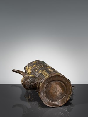 Lot 5 - A PARCEL-GILT COPPER REPOUSSÉ RITUAL EWER, DUOMUHU, TIBET, 19TH CENTURY