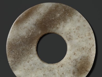 Lot 139 - A MOTTLED WHITE AND RUSSET JADE DISK, BI, QIJIA CULTURE