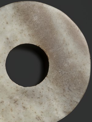 Lot 139 - A MOTTLED WHITE AND RUSSET JADE DISK, BI, QIJIA CULTURE